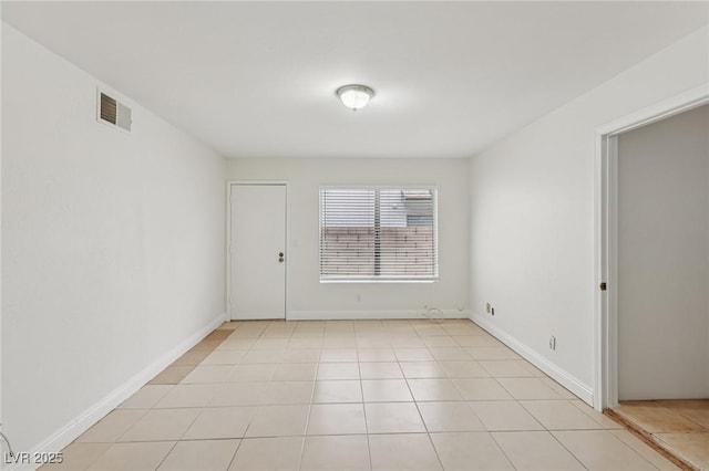7000 Paddington Way, Las Vegas, NV 89147 - empty room with light tile patterned flooring and baseboards
