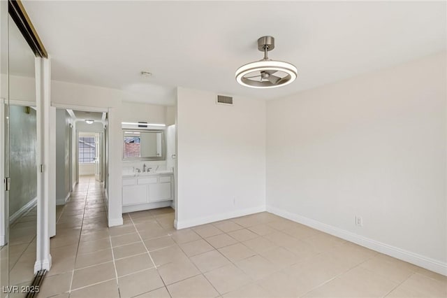 7000 Paddington Way, Las Vegas, NV 89147 - unfurnished room with light tile patterned floors and baseboards
