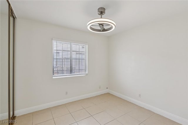 7000 Paddington Way, Las Vegas, NV 89147 - unfurnished room with baseboards and light tile patterned floors