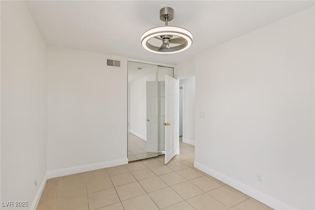 7000 Paddington Way, Las Vegas, NV 89147 - empty room with ceiling fan and light tile patterned floors
