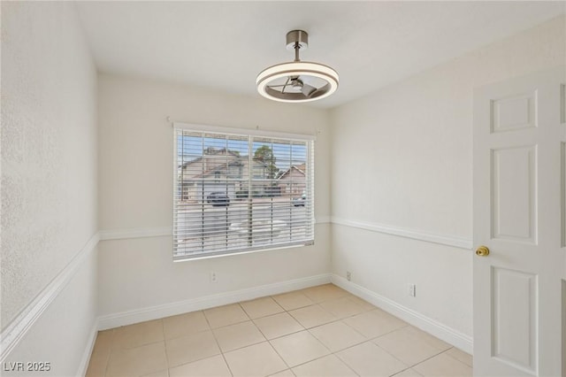 7000 Paddington Way, Las Vegas, NV 89147 - unfurnished room with light tile patterned floors and baseboards