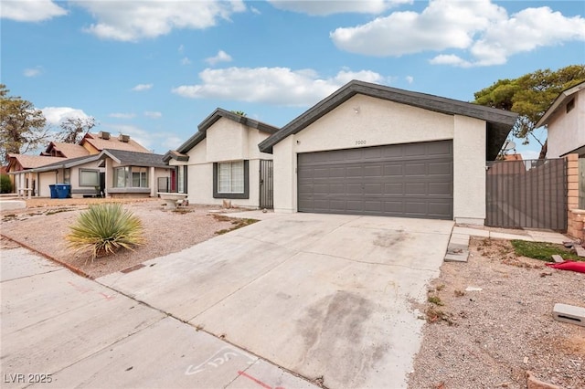 7000 Paddington Way, Las Vegas, NV 89147 - ranch-style house featuring a garage, driveway, and stucco siding