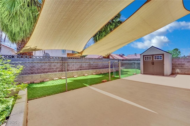1676 Divinity St, Las Vegas, NV 89142 - fenced backyard featuring a storage shed and a patio area