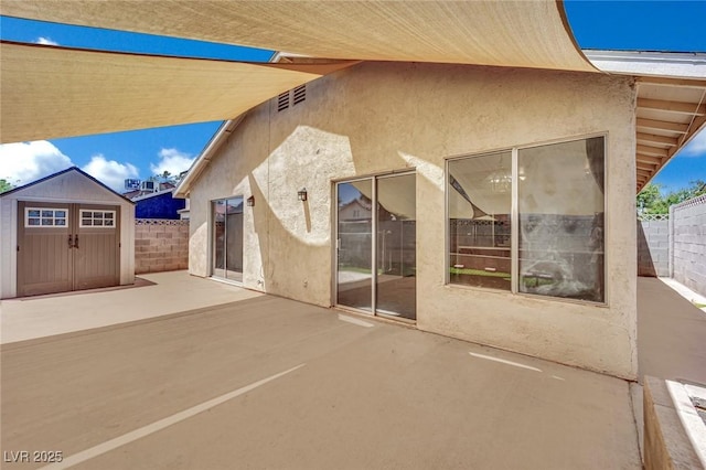 1676 Divinity St, Las Vegas, NV 89142 - view of patio / terrace featuring a storage unit