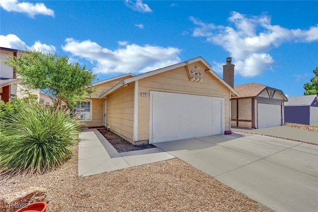 1676 Divinity St, Las Vegas, NV 89142 - ranch-style home featuring driveway, an attached garage, and a chimney