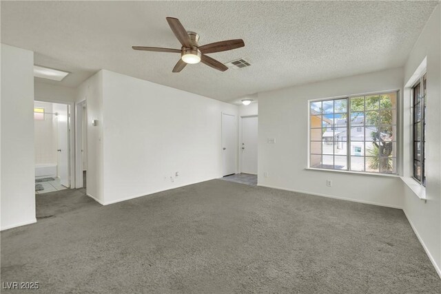 1676 Divinity St, Las Vegas, NV 89142 - carpeted empty room with a ceiling fan and a textured ceiling