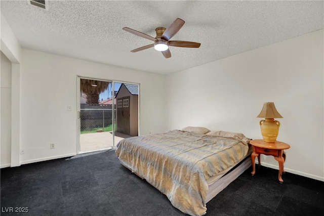 1676 Divinity St, Las Vegas, NV 89142 - bedroom with access to exterior, a textured ceiling, ceiling fan, and carpet flooring