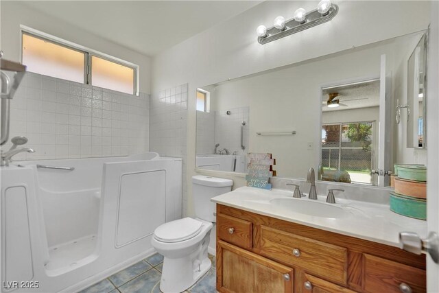 1676 Divinity St, Las Vegas, NV 89142 - bathroom with tile patterned flooring, vanity, and ceiling fan