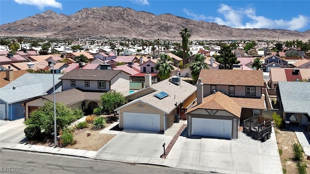 1676 Divinity St, Las Vegas, NV 89142 - aerial view of residential area with a mountainous background