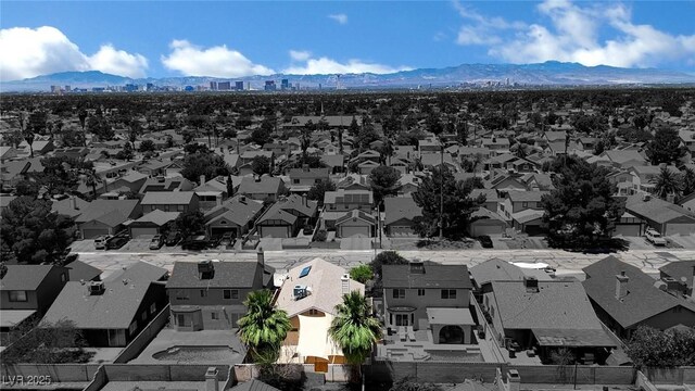 1676 Divinity St, Las Vegas, NV 89142 - aerial view of residential area with a mountain backdrop