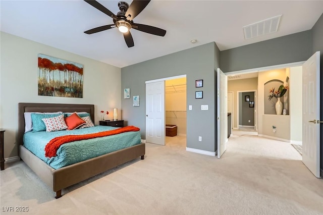 247 Integrity Ridge Dr, Henderson, NV 89052 - carpeted bedroom featuring a walk in closet, ceiling fan, and a closet