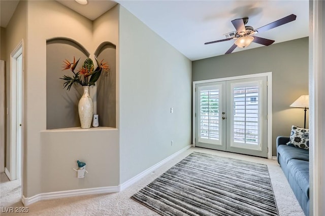 247 Integrity Ridge Dr, Henderson, NV 89052 - carpeted living area featuring french doors and a ceiling fan