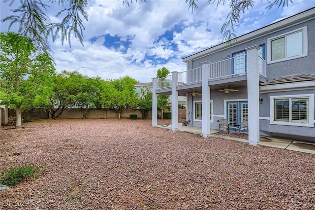 247 Integrity Ridge Dr, Henderson, NV 89052 - fenced backyard with ceiling fan, a balcony, and a patio