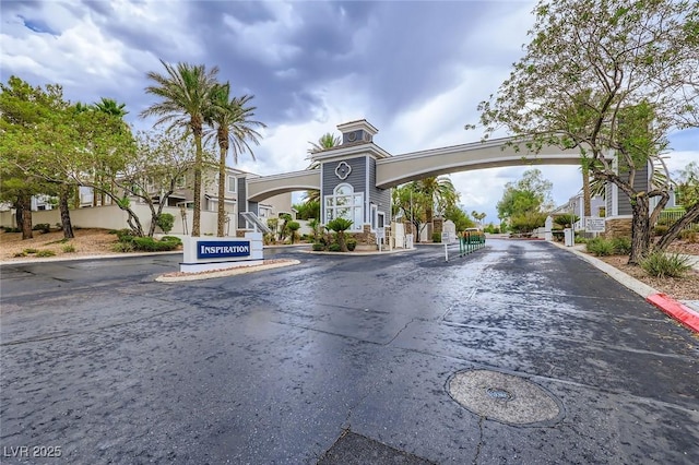 247 Integrity Ridge Dr, Henderson, NV 89052 - view of asphalt street featuring curbs and a gated entry