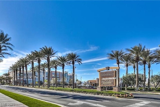 247 Integrity Ridge Dr, Henderson, NV 89052 - view of asphalt road featuring curbs, sidewalks, and street lights