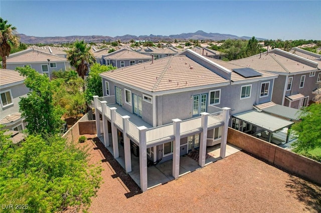 247 Integrity Ridge Dr, Henderson, NV 89052 - back of property featuring a patio area, stucco siding, a residential view, and a mountain view