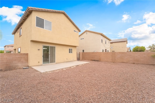3844 Kit Fox St, Las Vegas, NV 89122 - back of house with a patio, a fenced backyard, and stucco siding