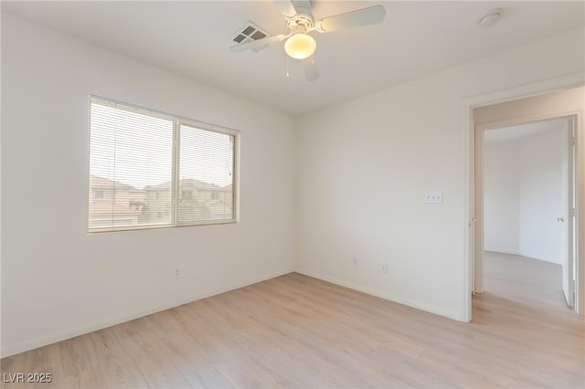 3844 Kit Fox St, Las Vegas, NV 89122 - unfurnished room with light wood-type flooring, a smoke detector, and ceiling fan