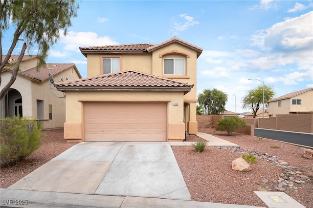3844 Kit Fox St, Las Vegas, NV 89122 - mediterranean / spanish-style home with concrete driveway, a tile roof, stucco siding, and an attached garage