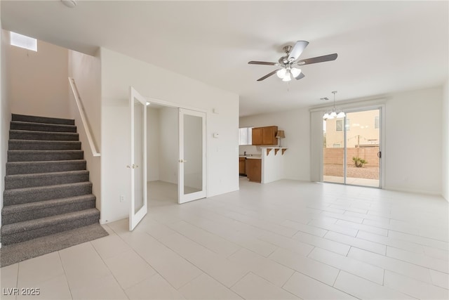 3844 Kit Fox St, Las Vegas, NV 89122 - unfurnished living room featuring stairway, ceiling fan, and french doors