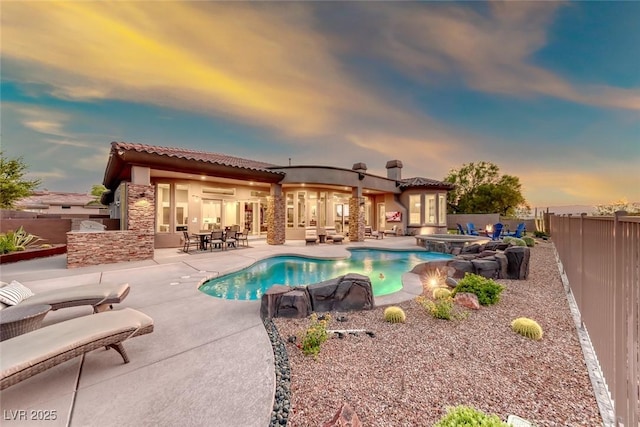 22 Starbrook Dr, Henderson, NV 89052 - view of pool with a fenced backyard, a patio, a pool with connected hot tub, and french doors