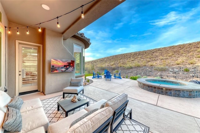 22 Starbrook Dr, Henderson, NV 89052 - view of patio / terrace featuring an in-ground hot tub and outdoor lounge area