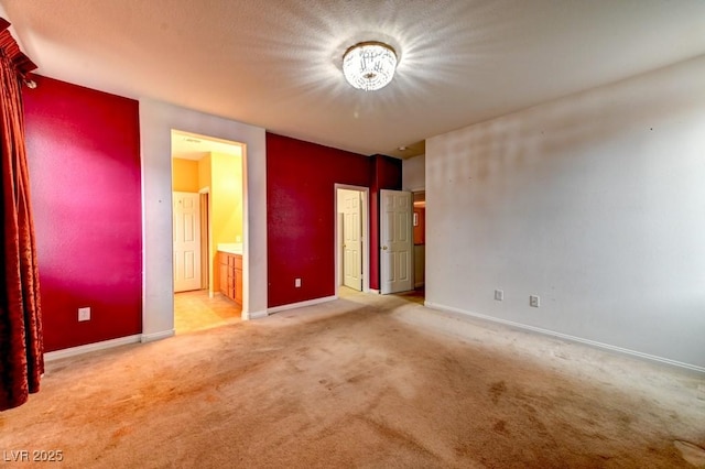 6720 Sand Swallow St, North Las Vegas, NV 89084 - unfurnished bedroom featuring carpet floors, a chandelier, and ensuite bath