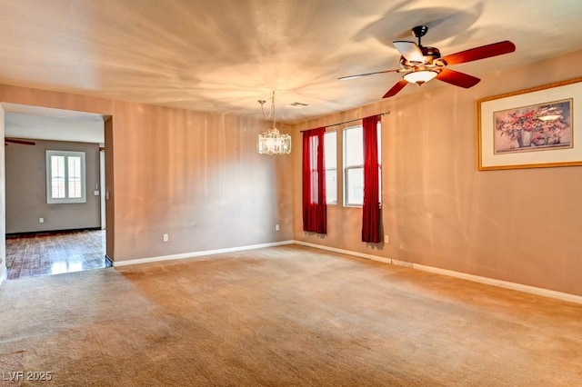 6720 Sand Swallow St, North Las Vegas, NV 89084 - carpeted empty room with a ceiling fan and a chandelier
