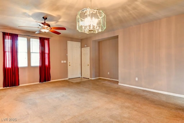 6720 Sand Swallow St, North Las Vegas, NV 89084 - spare room with a chandelier, a ceiling fan, and carpet flooring