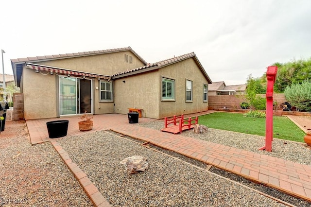 6720 Sand Swallow St, North Las Vegas, NV 89084 - back of property featuring stucco siding, a patio area, and a fenced backyard