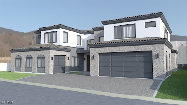 5 Rue Grimaldi Way, Henderson, NV 89011 - view of front facade with stone siding, a garage, a tile roof, and stucco siding