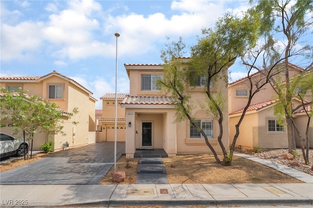 1641 Dark Wolf Ave, Las Vegas, NV 89123 - view of front of property featuring a tiled roof, stucco siding, driveway, and a garage