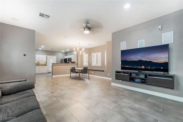 1641 Dark Wolf Ave, Las Vegas, NV 89123 - living area featuring a chandelier, light tile patterned floors, a ceiling fan, baseboard heating, and recessed lighting