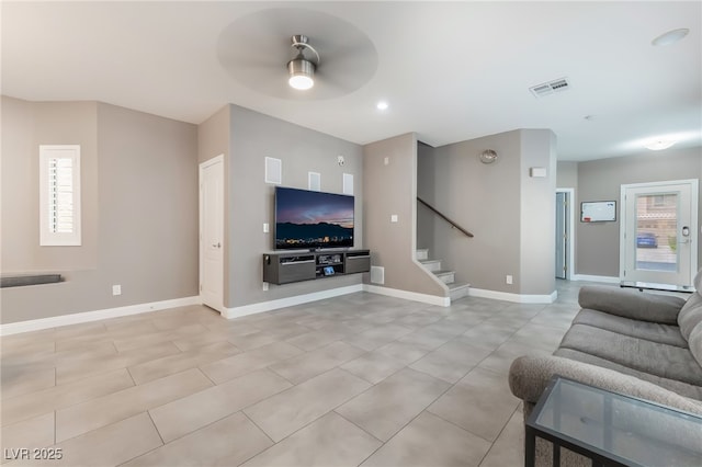 1641 Dark Wolf Ave, Las Vegas, NV 89123 - living area with a ceiling fan, stairway, and light tile patterned floors