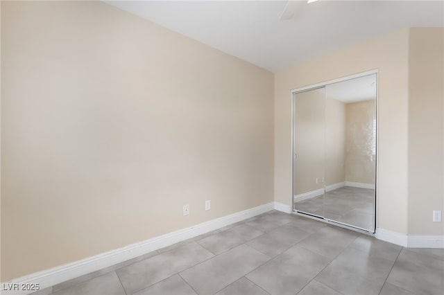 1641 Dark Wolf Ave, Las Vegas, NV 89123 - unfurnished bedroom with a closet, a ceiling fan, and light tile patterned floors