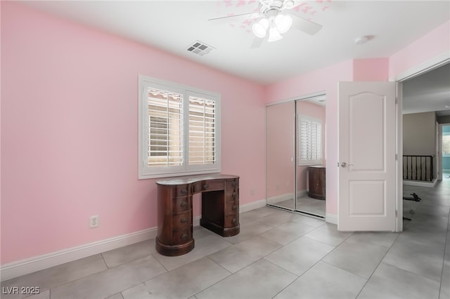 1641 Dark Wolf Ave, Las Vegas, NV 89123 - unfurnished bedroom featuring a closet, ceiling fan, and light tile patterned flooring
