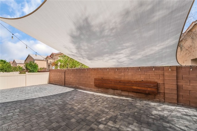 1641 Dark Wolf Ave, Las Vegas, NV 89123 - fenced backyard with a patio