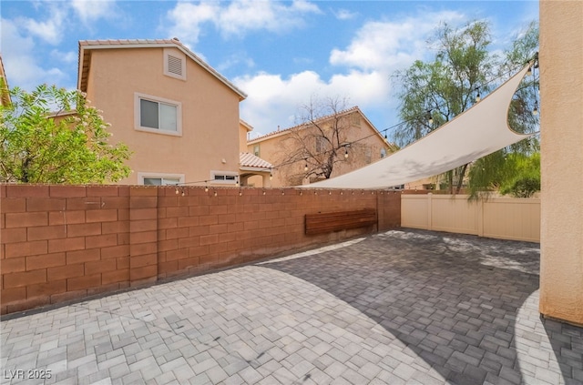1641 Dark Wolf Ave, Las Vegas, NV 89123 - fenced backyard with a patio area