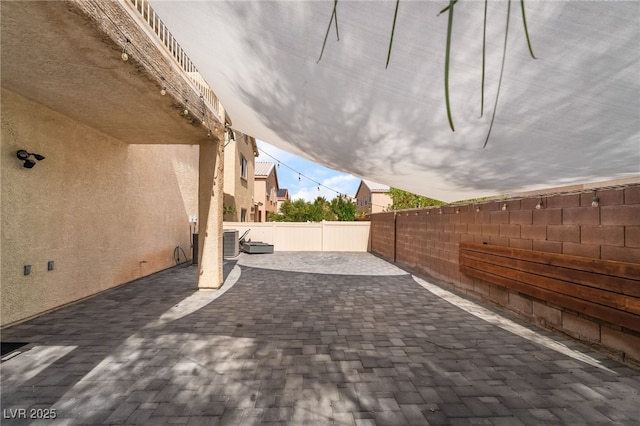 1641 Dark Wolf Ave, Las Vegas, NV 89123 - fenced backyard featuring a patio area
