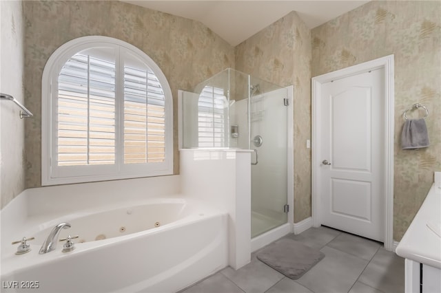 1641 Dark Wolf Ave, Las Vegas, NV 89123 - bathroom featuring wallpapered walls, a shower stall, a jetted tub, tile patterned flooring, and vaulted ceiling