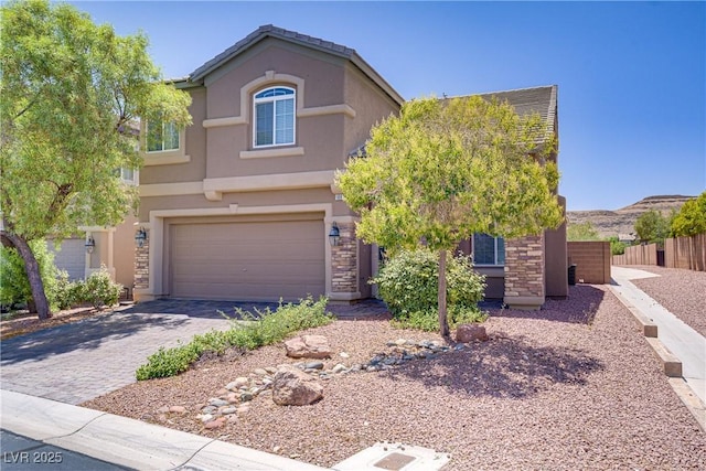 10015 Willowbrook Pond Rd, Las Vegas, NV 89148 - view of front of property with a garage, stucco siding, and driveway