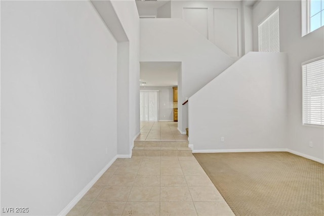 10015 Willowbrook Pond Rd, Las Vegas, NV 89148 - carpeted foyer entrance with tile patterned floors and stairway
