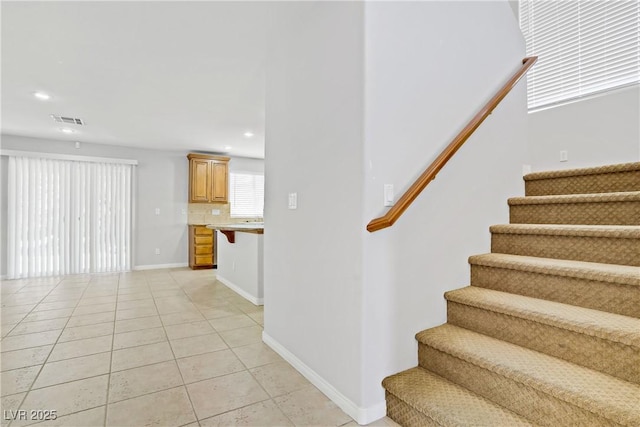 10015 Willowbrook Pond Rd, Las Vegas, NV 89148 - staircase with tile patterned floors and recessed lighting