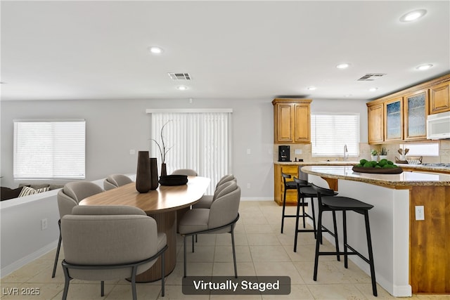 10015 Willowbrook Pond Rd, Las Vegas, NV 89148 - dining room featuring recessed lighting and light tile patterned floors