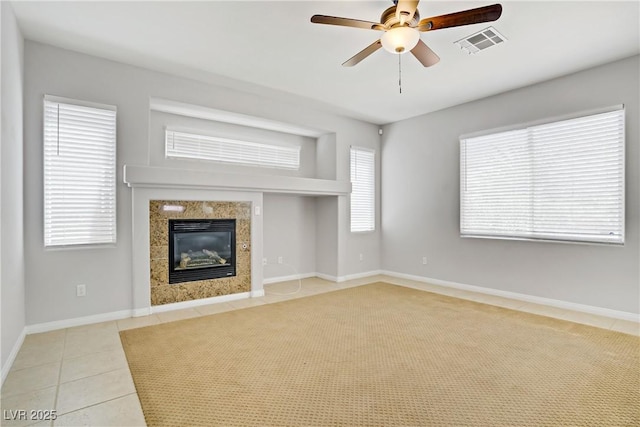 10015 Willowbrook Pond Rd, Las Vegas, NV 89148 - unfurnished living room featuring ceiling fan, a fireplace, and tile patterned flooring