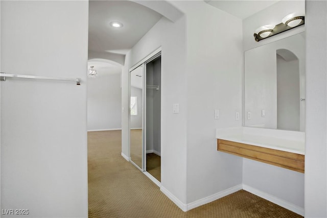 10015 Willowbrook Pond Rd, Las Vegas, NV 89148 - hall with arched walkways, carpet floors, and recessed lighting