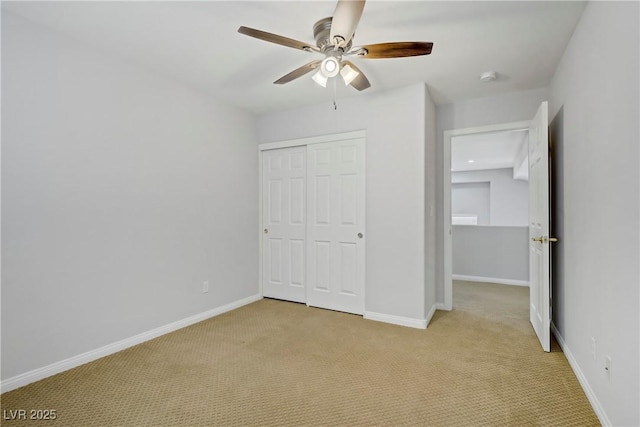 10015 Willowbrook Pond Rd, Las Vegas, NV 89148 - unfurnished bedroom with light carpet, a closet, and ceiling fan