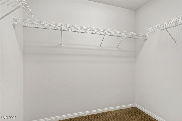 10015 Willowbrook Pond Rd, Las Vegas, NV 89148 - walk in closet with dark carpet