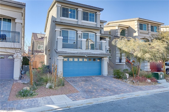 7075 Jasper Hill Way, Las Vegas, NV 89118 - view of front of property with an attached garage, stucco siding, and driveway