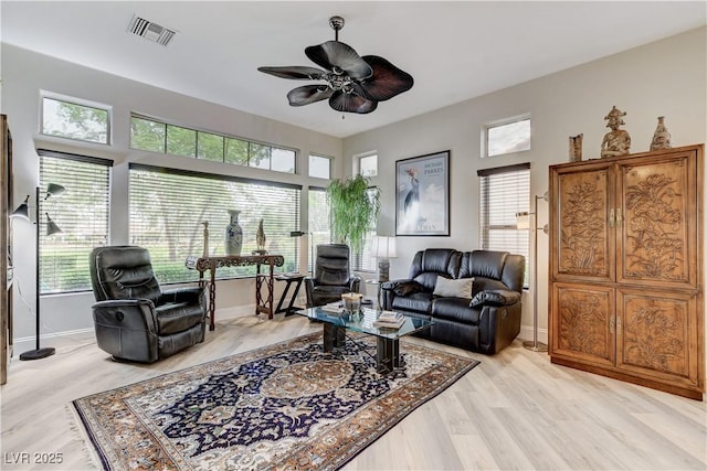 2832 Castle Bar Dr, Las Vegas, NV 89134 - living area featuring a ceiling fan, plenty of natural light, and light wood-type flooring
